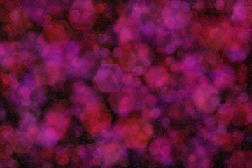 hexagon shaped bokeh with purple and red colors on dark background © iushakovsky
