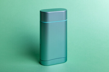 Deodorant in turquoise color design. Hygienic product in a steel case.