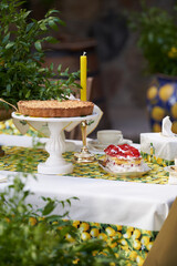 Table with apple pie, fruits snacks. Spring concept