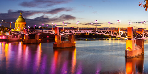 Toulouse Pont Saint-Pierre bridge with Garonne river at twilight panorama in France