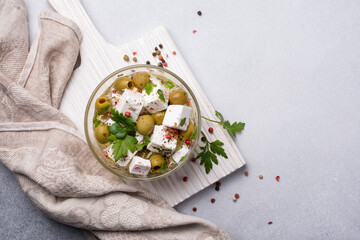 Bowl of delicious olives with Feta cheese in oil