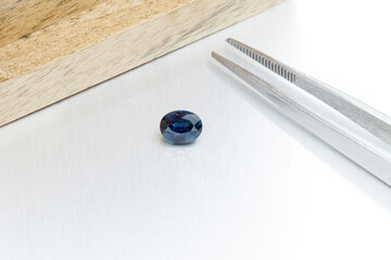 macro mineral faceted stone Sapphire on a gray background
