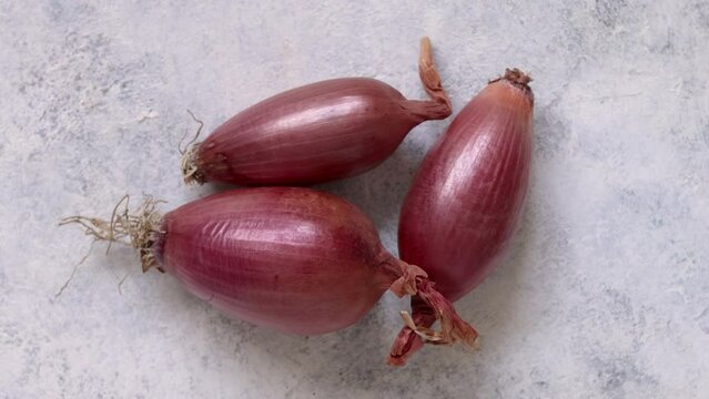 Fresh tropea red onions turning on a white table top view, concept of cooking at home in the kitchen, Traditional Italian cousin ingredient