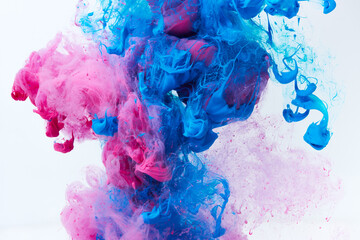 Paints splash curves in water on white. Acrylic purple and blue paint drop background. Abstract...
