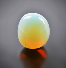 Moonstone, a natural mineral gemstone on a dark background