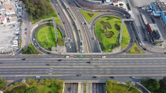Freeway turnaround loops in Lima Peru. Avenue Javier Prado. 4k Drone footage, slowly tilting up and flying backwards.