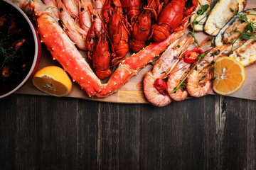 a plate of various snacks, seafood, mussels, boiled crayfish, shrimps