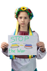 A little sad Ukrainian girl holds a drawing in her hands with the inscription 
