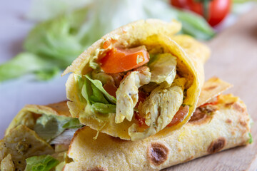 Chicken wrap with salad and tomato. Idea for a tasty and healthy lunch.