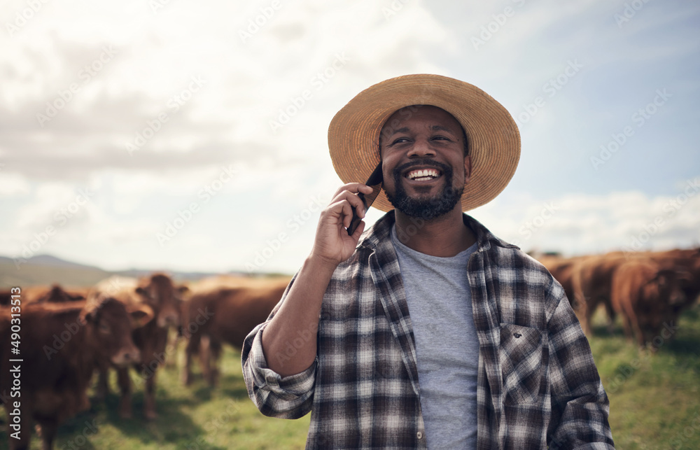 Poster call him for the best cattle in agribusiness. shot of a mature man using a smartphone while working 