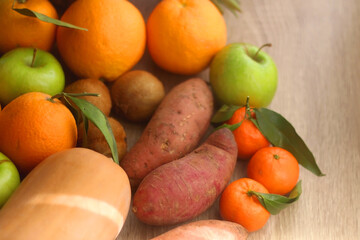 Various healthy fruit and vegetable on wooden background. Selective focus.