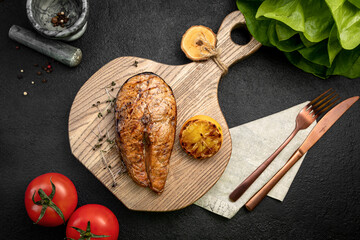 grilled salmon steak served with grilled lemon