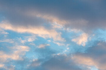 Full frame clouds during a sunset. Orange and teal heavy clouds