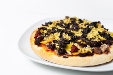 Close-up of homemade vegan pizza on white background.
