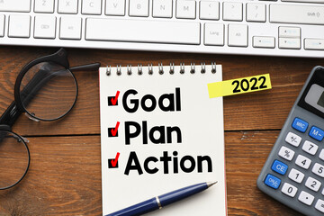 Goal,plan,action text on notepad with office accessories.Business motivation,inspiration concepts ideas