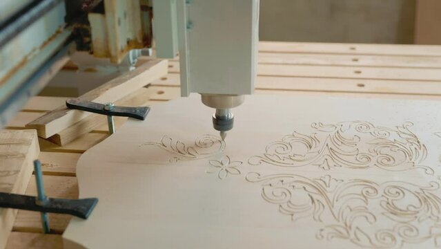CNC machine processes a wood blank close-up
