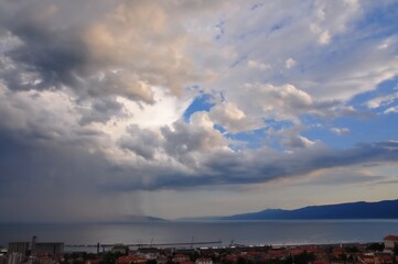 Stormy black clouds in Croatian coastline.Dark sky and black clouds at dusk. Dark sky and rain clouds. Dark storm and rainy at night. Dramatic cloudscape in rain weather. Stormy clouds