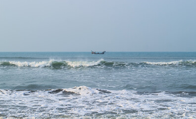 Photo of Industrial fishing boat. Fishing boat in the sea. The fishing industry in India. Indian traditional fishing boat.