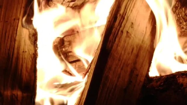 Minute video of bright fire in the fireplace close-up