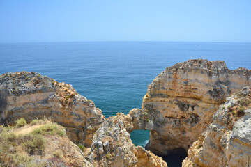 Algarve, Portugal, rock arch in water.