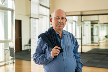 Portrait of senior businessman looking at camera