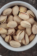 Organic pistachios on a dark background