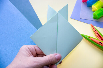 step by step how to make an origami rabbit. easter holiday, greeting card. cute sleeping bunny. Do it yourself concept, activities for kids. instructions for art project for preschool.  rabbit 2023