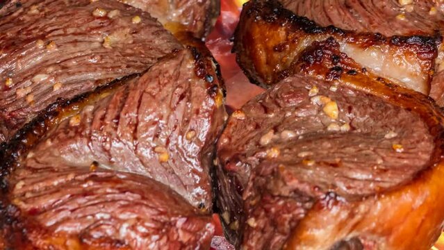 Zoom out of Picanha barbecue on the grill.