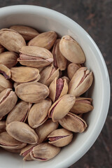 Organic pistachios on a dark background