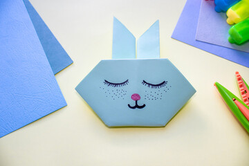 step by step how to make an origami rabbit. easter holiday, greeting card. cute sleeping bunny. Do it yourself concept, activities for kids. instructions for art project for preschool.  rabbit 2023