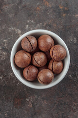 Macadamia nuts on a dark background