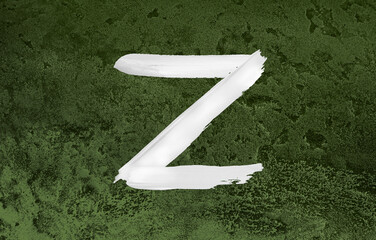 Z Letter Brush Paint Stroke on green metallic texture