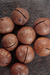 Macadamia nuts on a dark background