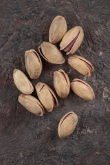 Organic pistachios on a dark background