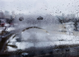 unhappy face drawn on glass