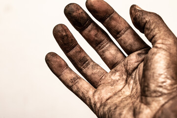 Hand of a worker very dirty for the job