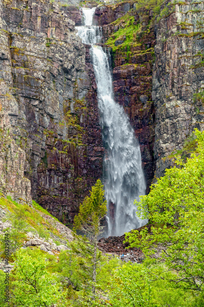 Poster Waterfall on a rock wall in a canyon with lush trees