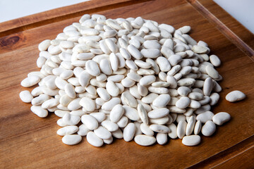 Stack of beans close-up on wooden background