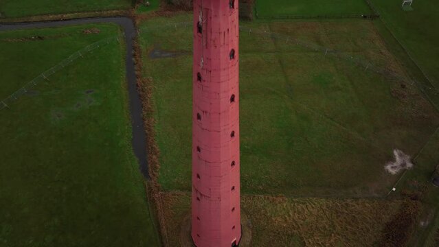 Lighthouse tower Lange Jaap in Den Helder drone aerial footage 5K along the sea near the island of Texel in North Holland, The Netherlands.