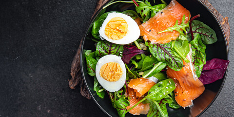 salad salmon, egg, green leaves lettuce fresh portion healthy meal food diet snack on the table copy space food background 