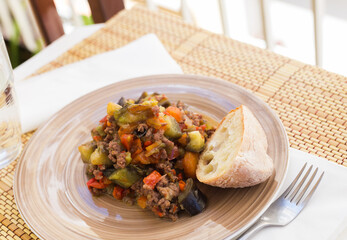 dish of vegetable stew. stewed eggplant, minced meat, carrots, peppers, onion squid
