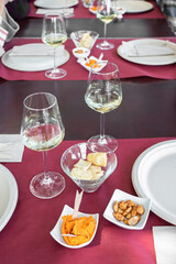 Table setting with empty wine glasses and snack in winery  , Wine tasting experience concept.