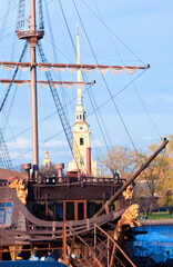 The spire of Peter and Paul fortress with masts ship as background, St. Petersburg, Russia