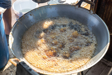 Chef cooking crispy fried chicken in the big pan to Chinese banquet food preparation. fat from trans-fat concept. Disease from cholesterol and Trans-fatty concept. 