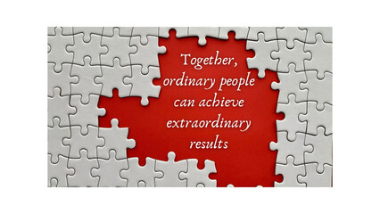Top view of motivational quote on red cover - Together, ordinary people can achieve extraordinary results.With jigsaw puzzle missing pieces background.