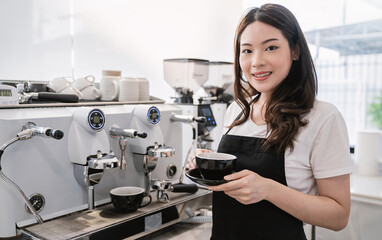 Startup successful small business owner sme woman, beauty asia girl use coffee machine in coffee shop restaurant. Portrait of asian woman barista cafe owner. SME entrepreneur business seller concept