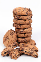 Homemade cookies with small pieces of chocolate in composition on white background.