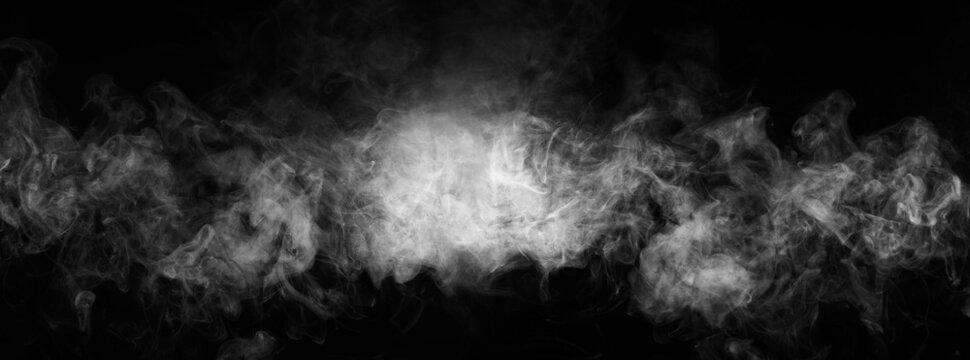 Abstract smoke texture over black. Fog in the darkness.