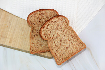 square slices of toasted dark rye bread