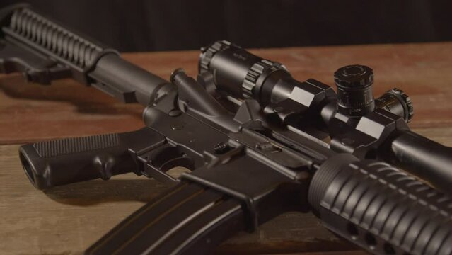 Dolly out of a loaded AR-15 lying on a wooden surface